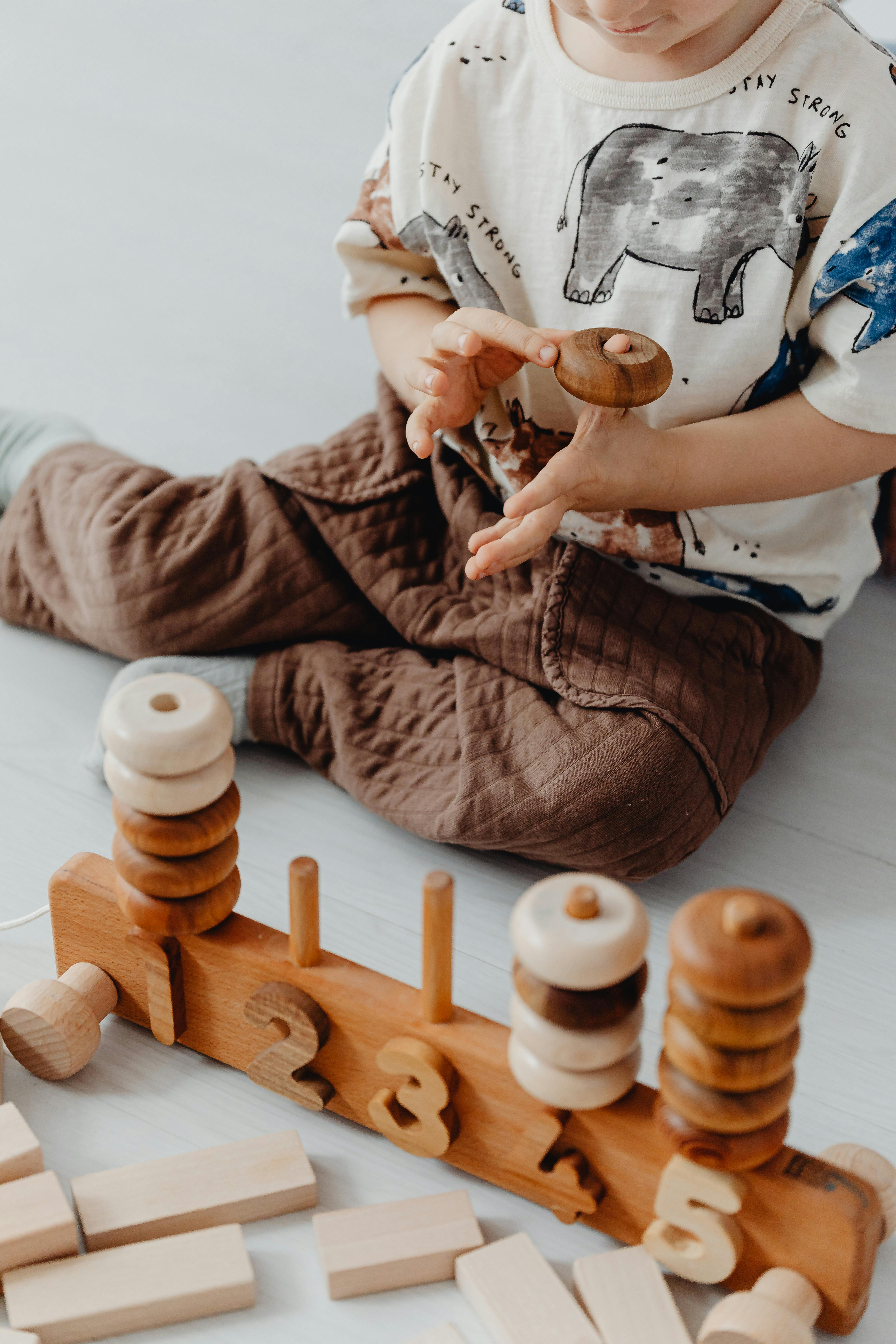 Child playing with Montessori counting ring stacker