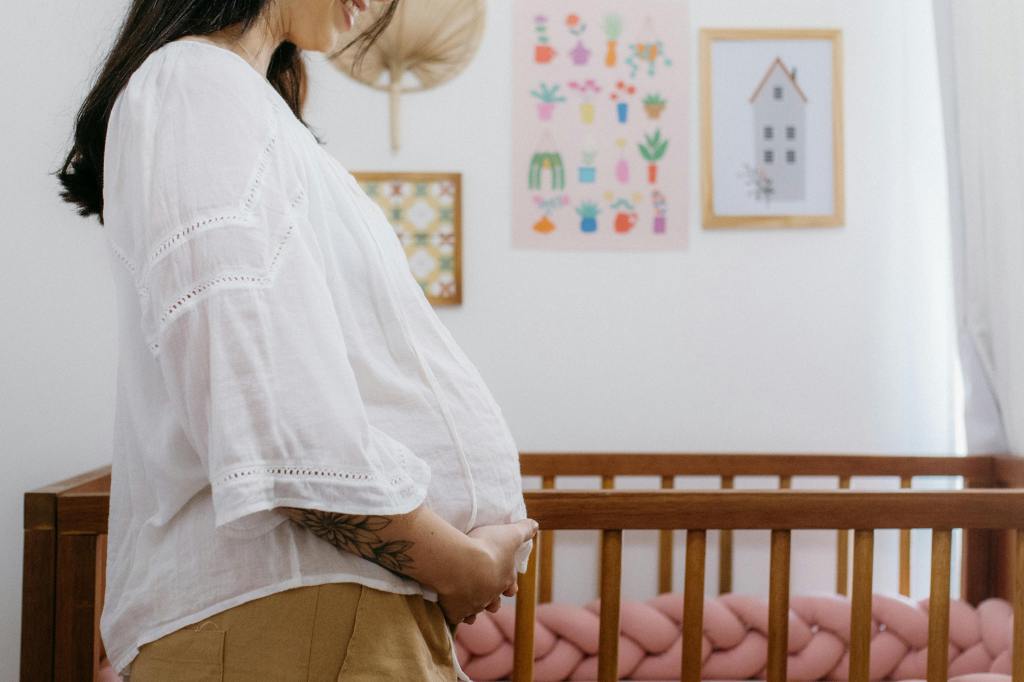 Pregnant mom in a nursery