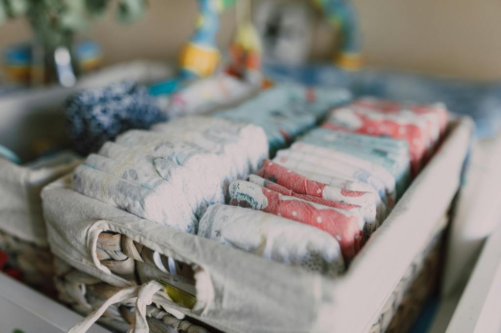 Diapers organized on a changing table