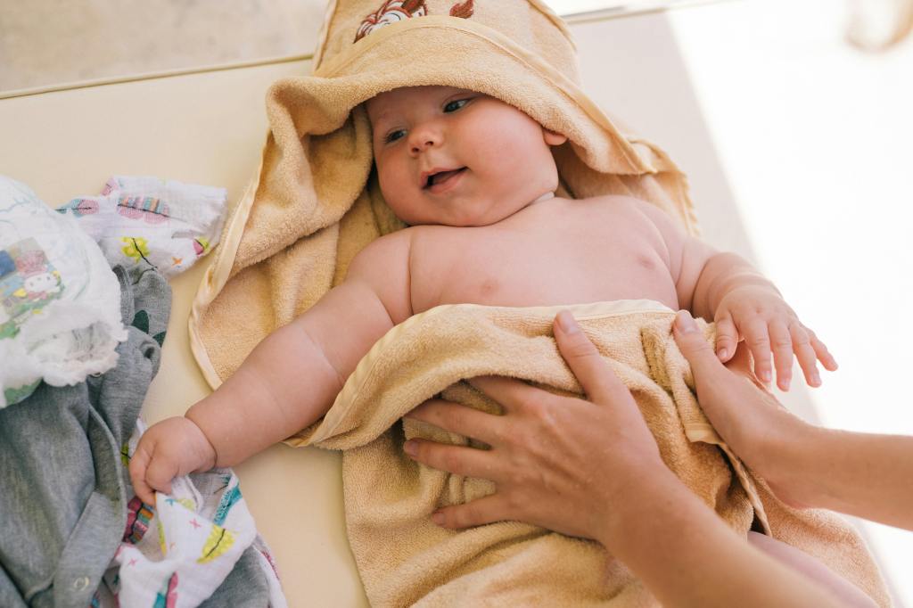 Baby wrapped in a towel after a bath