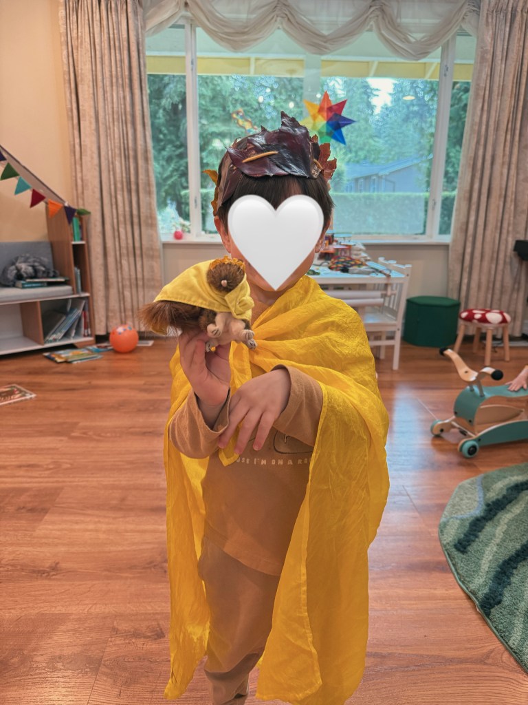 golden cape and leaf crown michaelmas